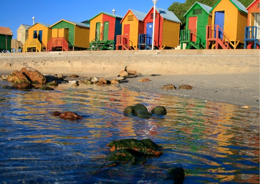 St James beach is well known for its colourful Victorian-style bathing boxes, tidal pool and rock pools