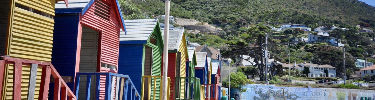 See the colourful huts on a Peninsula Tour